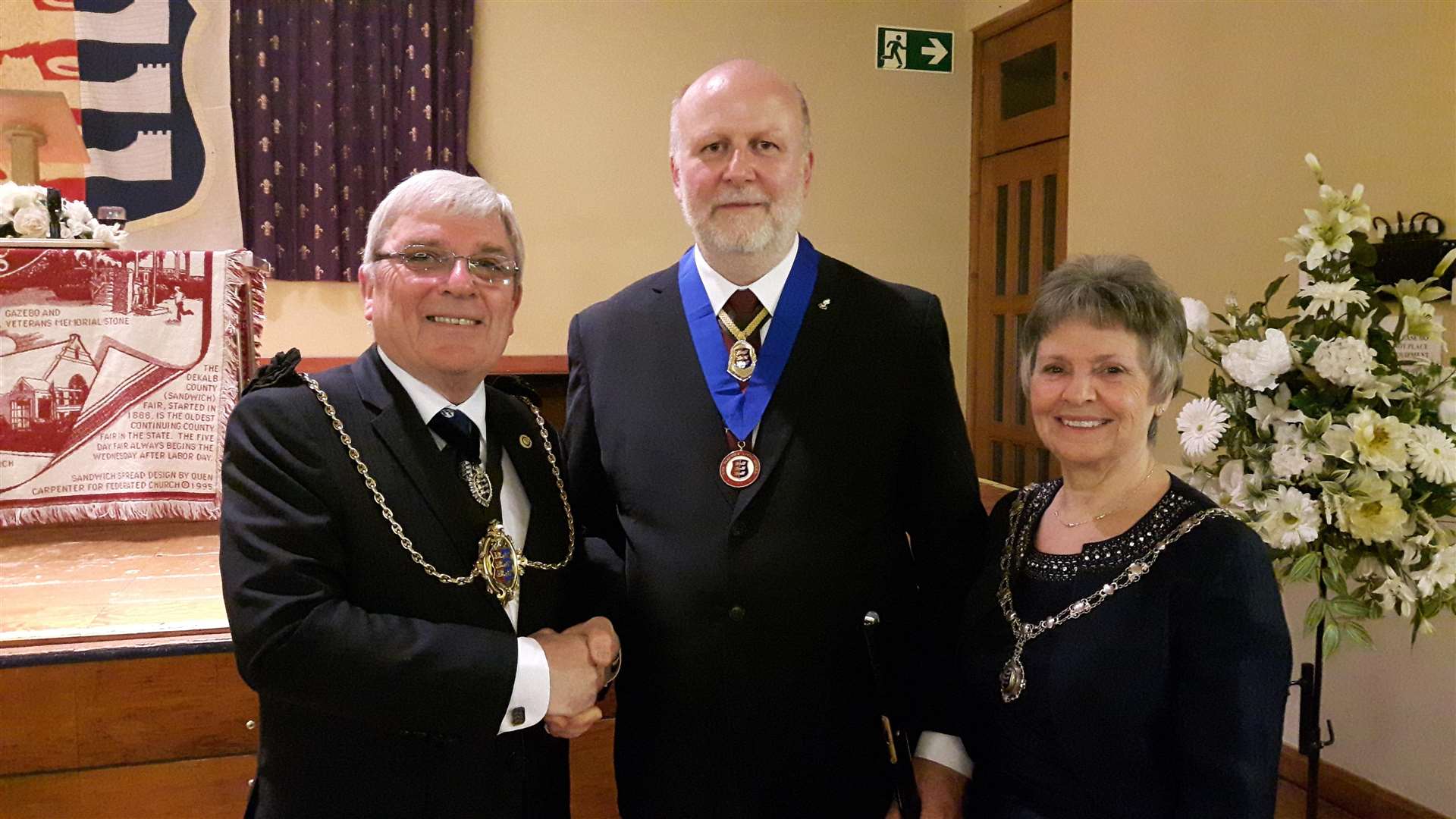 Simon Leith (centre), receiving his civic award, is one of three local heroes chosen to switch the town's lights on