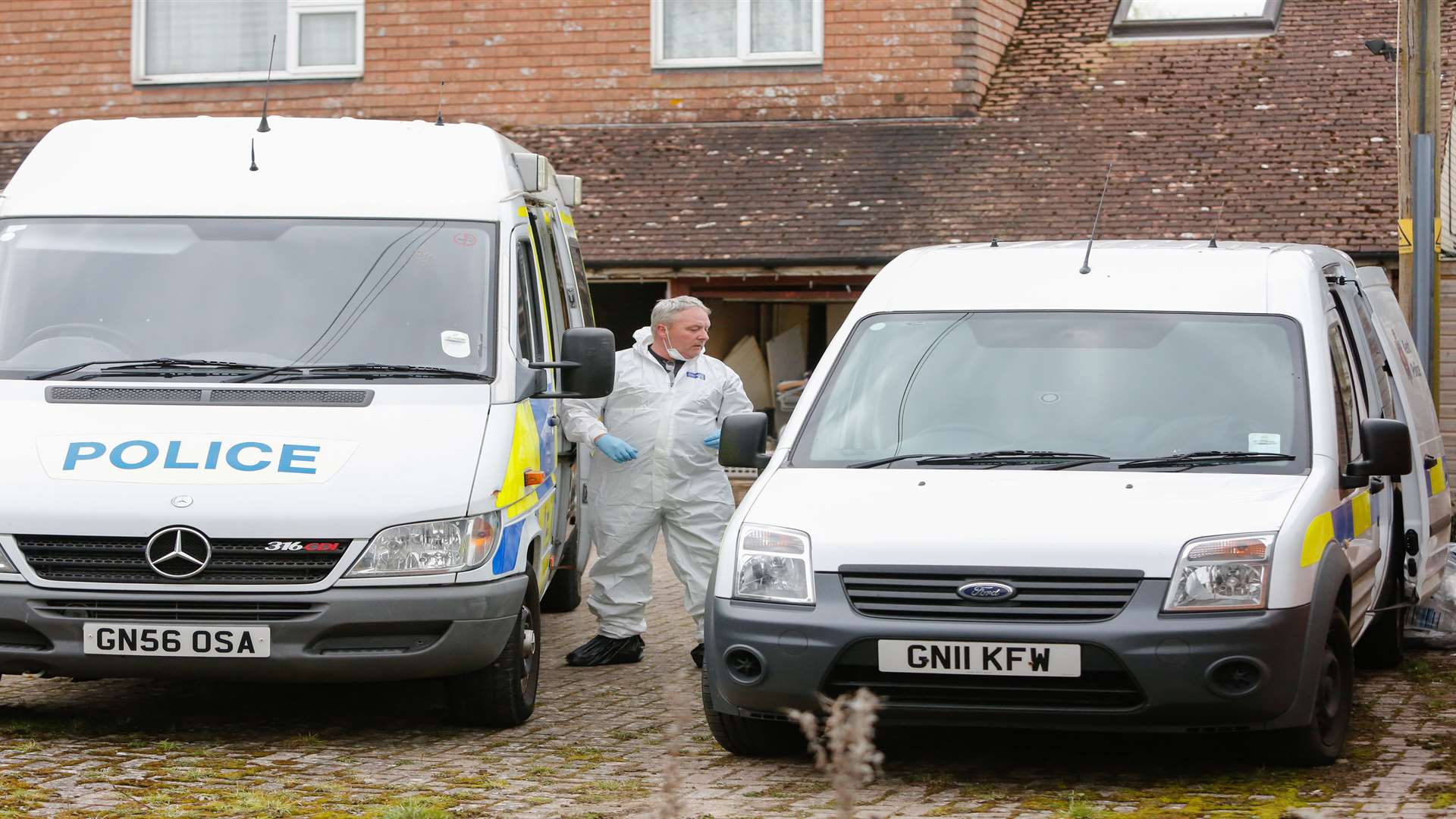 Police on the scene at Heartsay Bungalow, Biddenden after the discovery of Roy Blackman's body