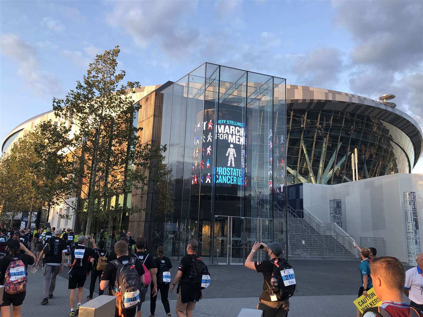 The Tottenham Hotspur Stadium lit up for March for Men. Photo: Justin Foote.