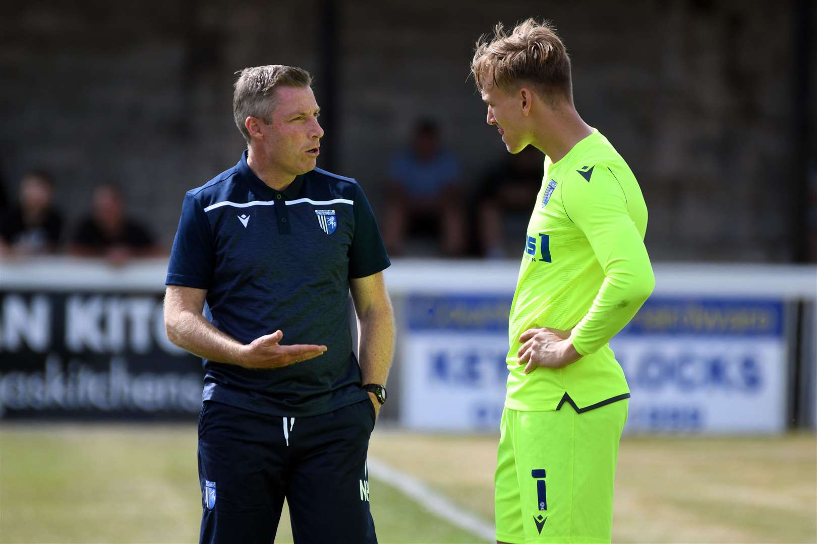 Gillingham manager Neil Harris chatting with goalkeeper Ashley Maynard-Brewer. The Charlton goalie is fit again after a summer injury Picture: Barry Goodwin