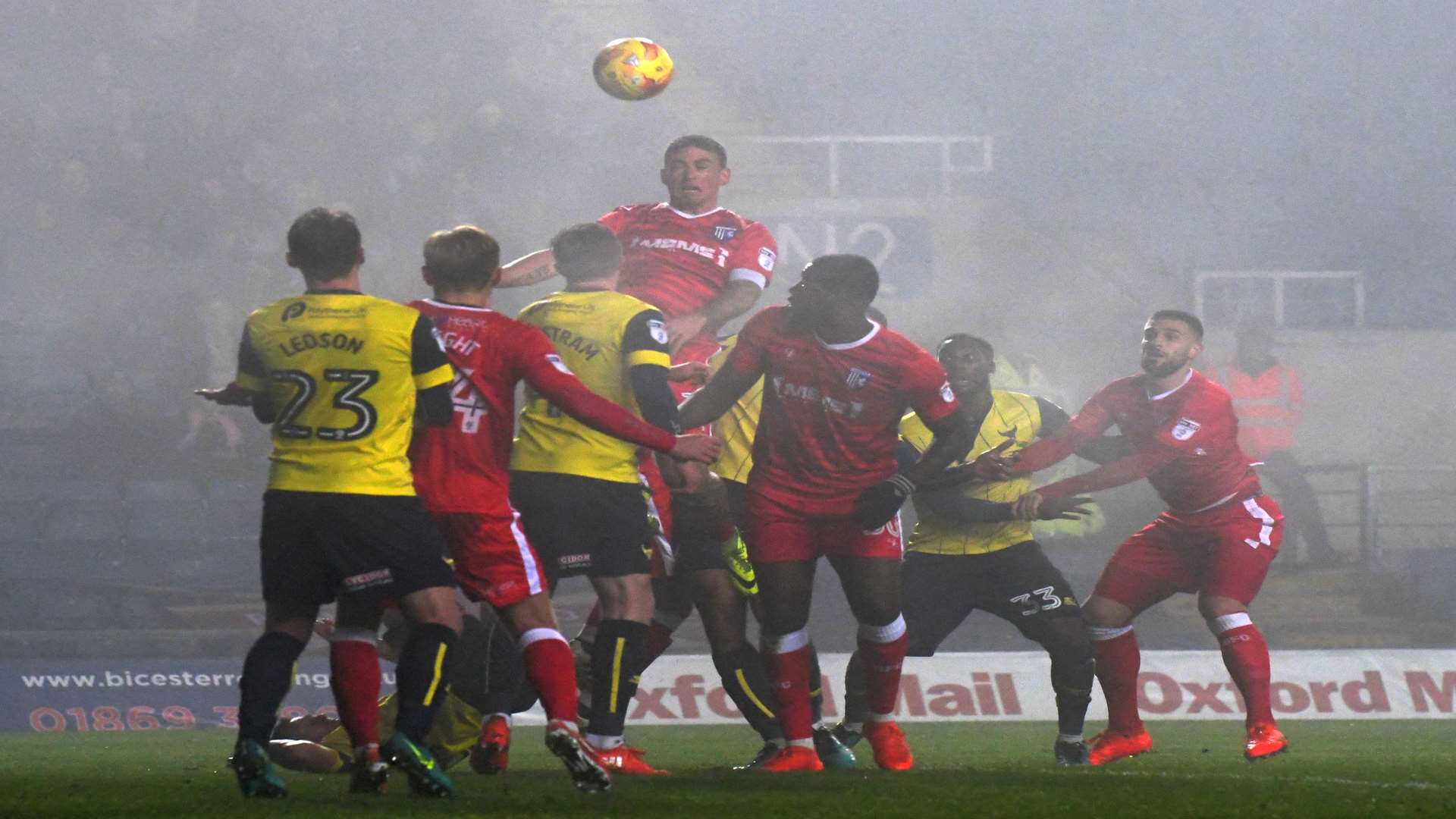 Gillingham challenge for the ball in foggy conditions Picture: Barry Godwin