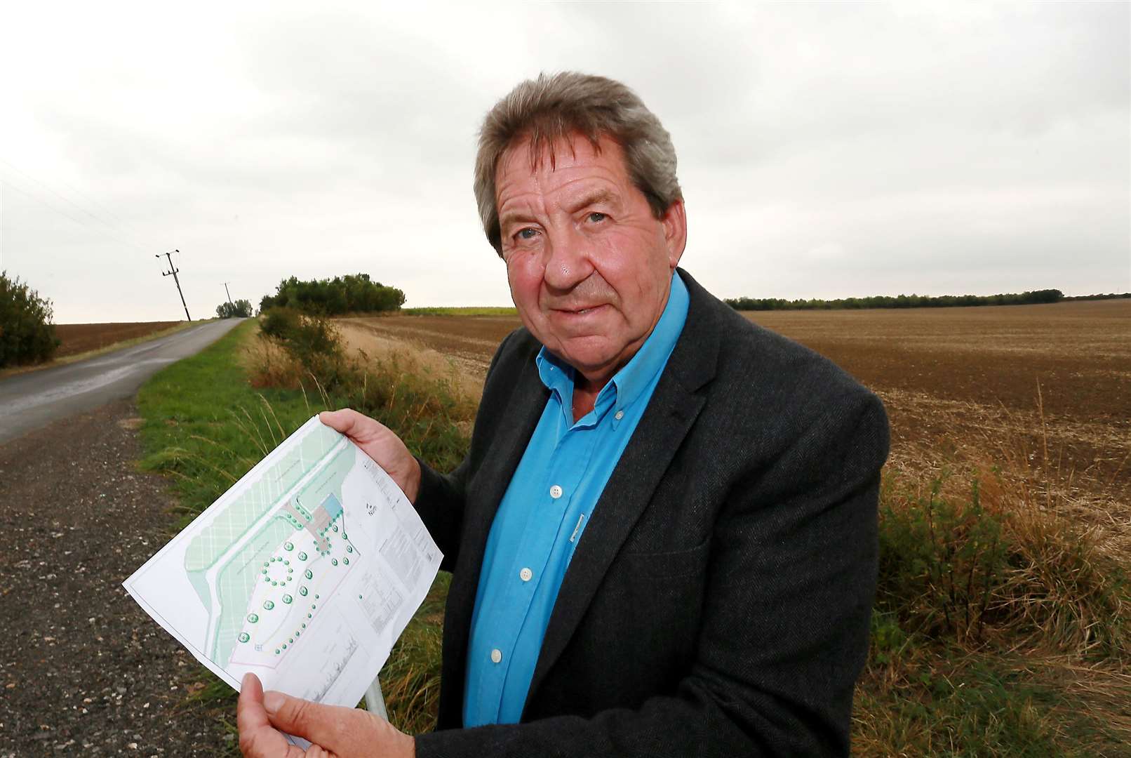 MP Gordon Henderson at the new Sheppey Natural Burial Ground at Harty with the site drawings