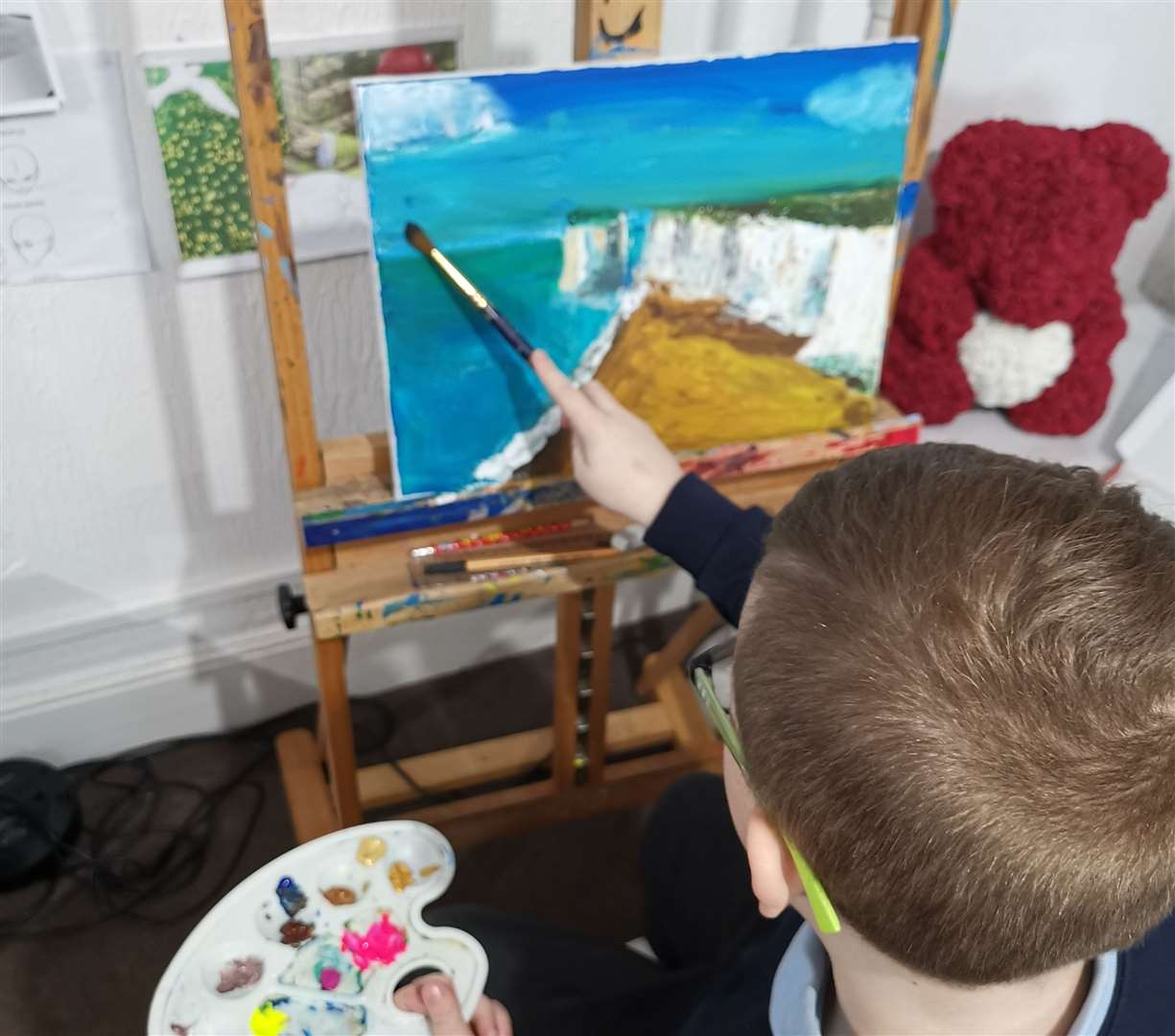 Max is painting an image of Botany Bay which he will sell to raise money for charity