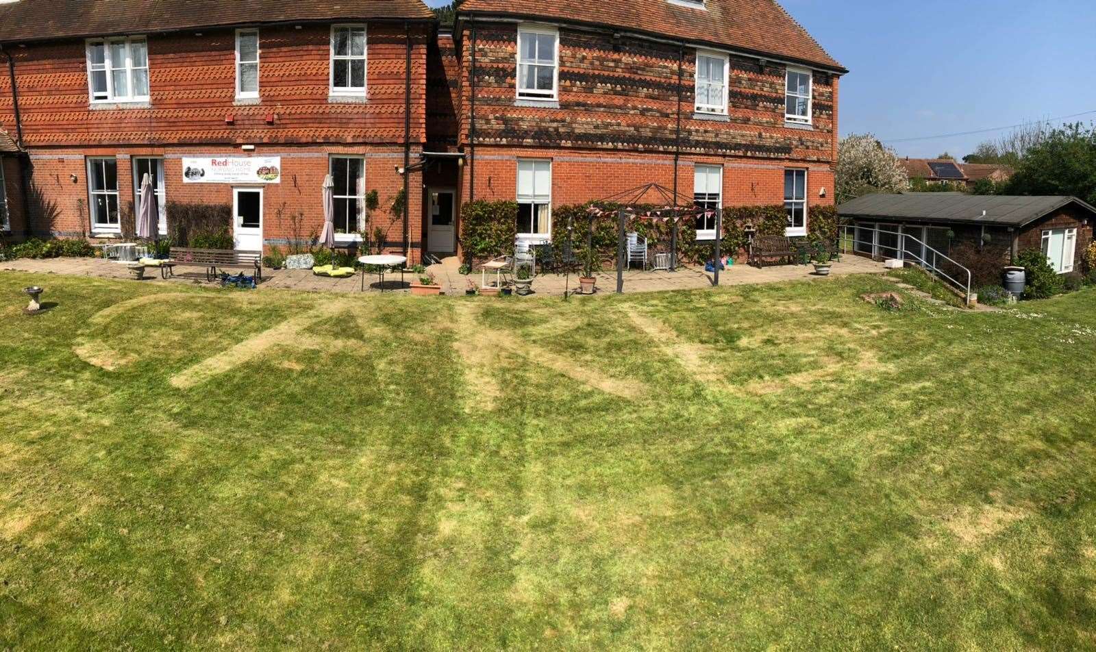 Steven Kirkham mowed "CARE" into the grass. Picture: Kevin D'Lima