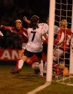Karen Carney and Fara Williams scramble to put the ball in the net