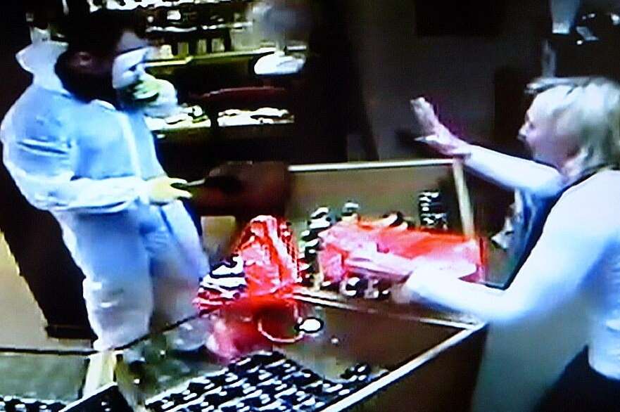 One of the raiders was caught on camera inside Andrew Smith Jewellers in West Malling