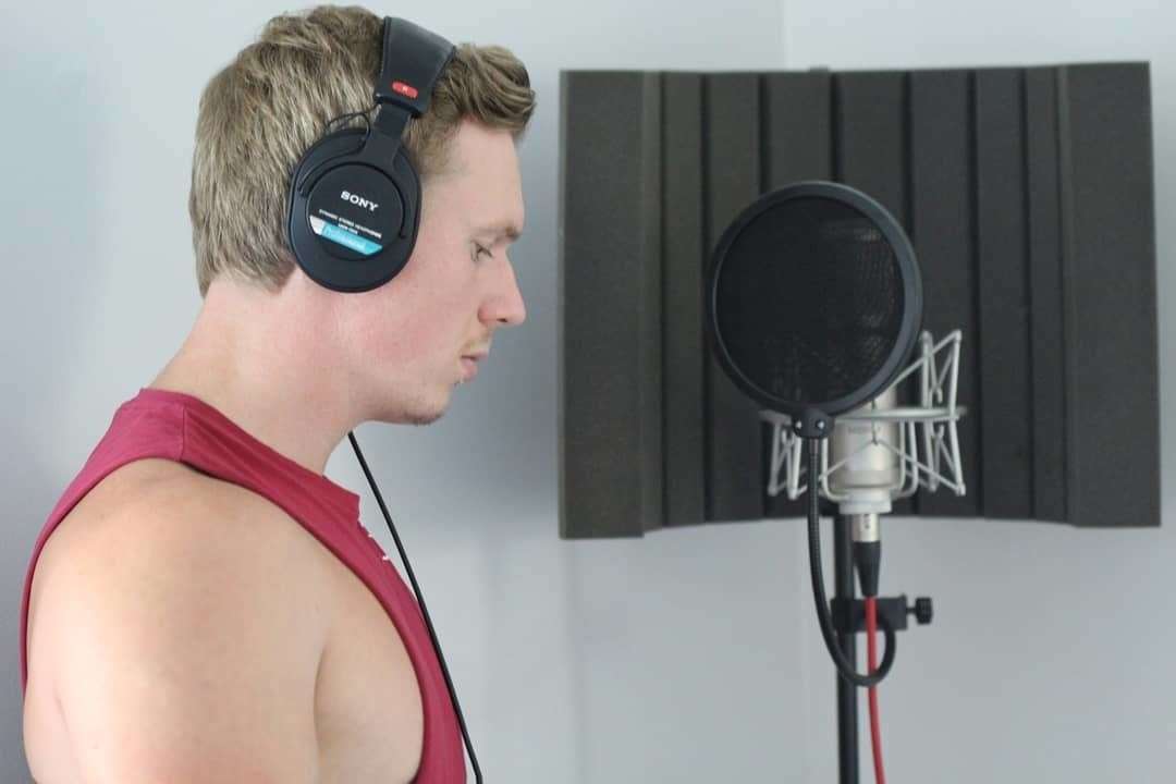 Singer Karl Schilg recording his single Dancing In The Rain at his home studio on the Isle of Sheppey