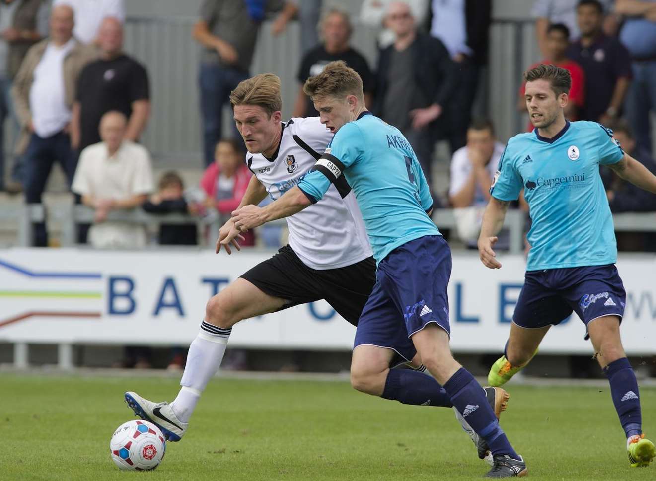Tom Bradbrook battles with AFC Telford captain Steve Akrigg Picture: Andy Payton