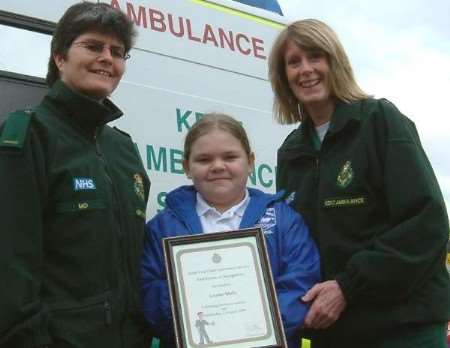Lauren receiving the certificate from Mo Rice and Kay Townsey