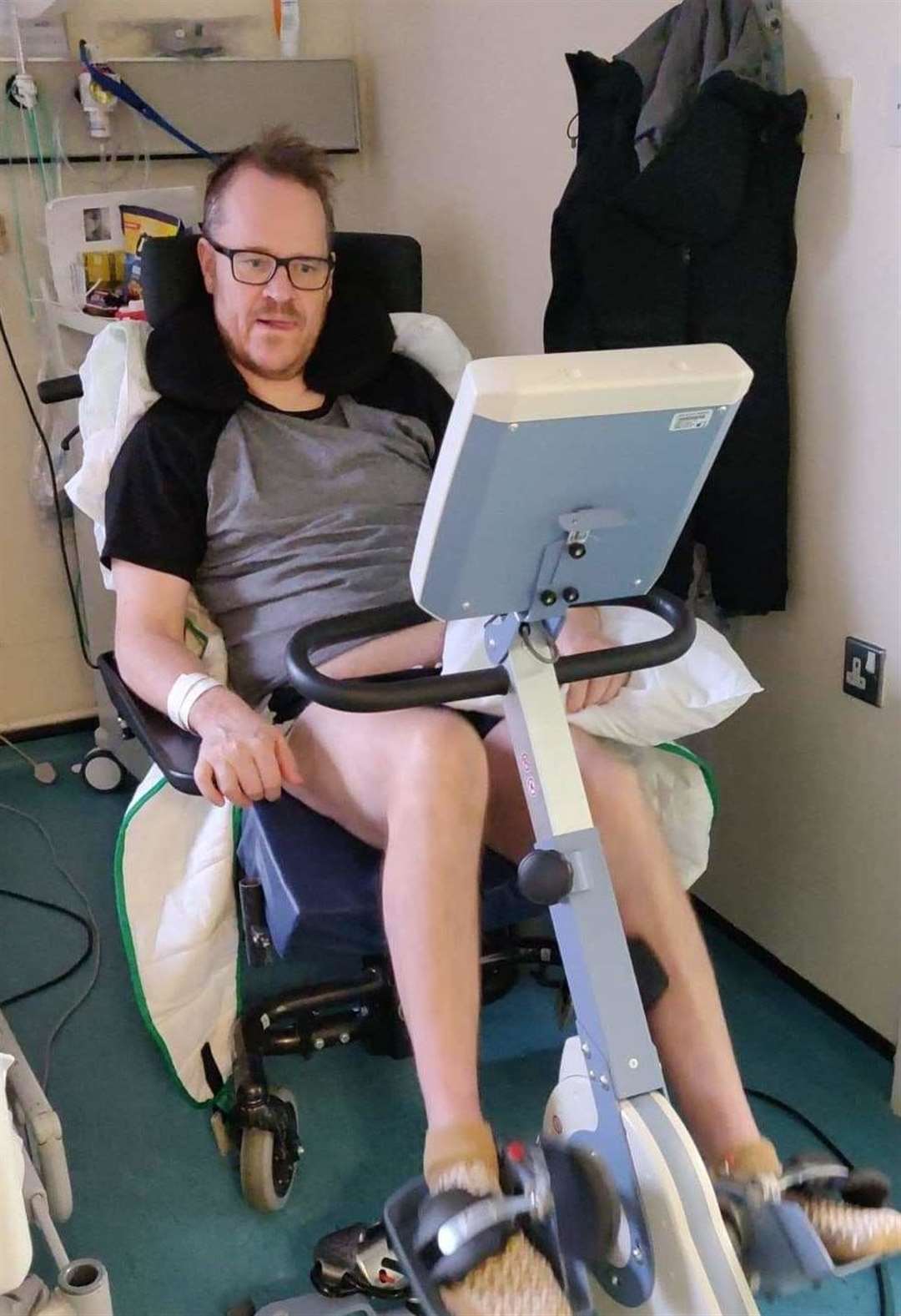 Paul Ives, 54, undergoing physiotherapy in hospital to learn to walk again, after being paralysed down his left side Pic: The Brain Charity