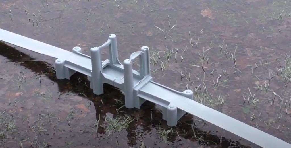 Engineer Dale Dempsey has made a model of Sheppey's Kingsferry Bridge out of two carrot slicers and installed it in his pond in Norfolk to remind him of the Island. Stills from Dale Dempsey's video