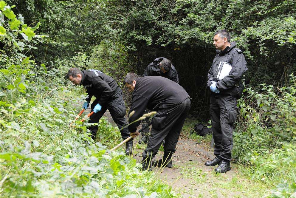 Forensics officers in an area around Singleton Lake where one of the assaults took place