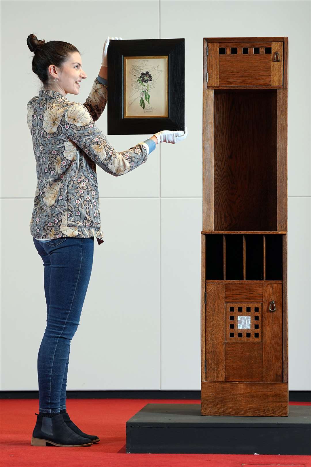 Design specialist Olivia Ross with the Mackintosh works that will be part of the auction (Lyon & Turnbull/PA)