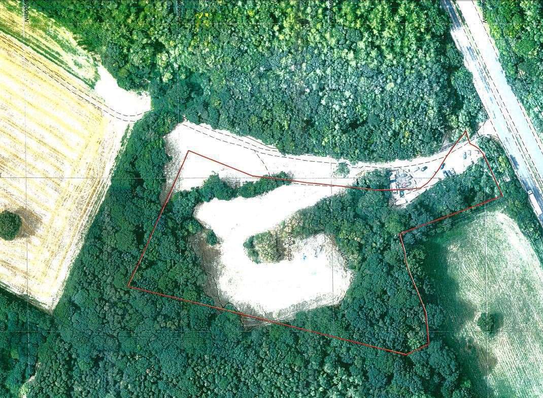 An aerial view of the land taken last year. The site is denoted in red.