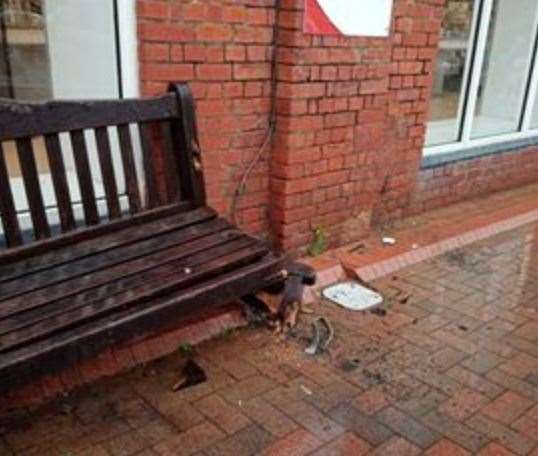 A wooden bench at the front of the store was damaged