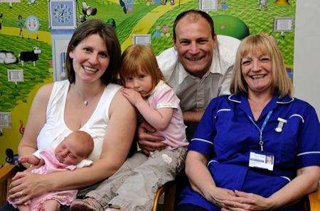 Melissa Beck with new baby Victoria, daughter Abigail, two, husband Andy and midwife Heather Scott who delivered Victoria
