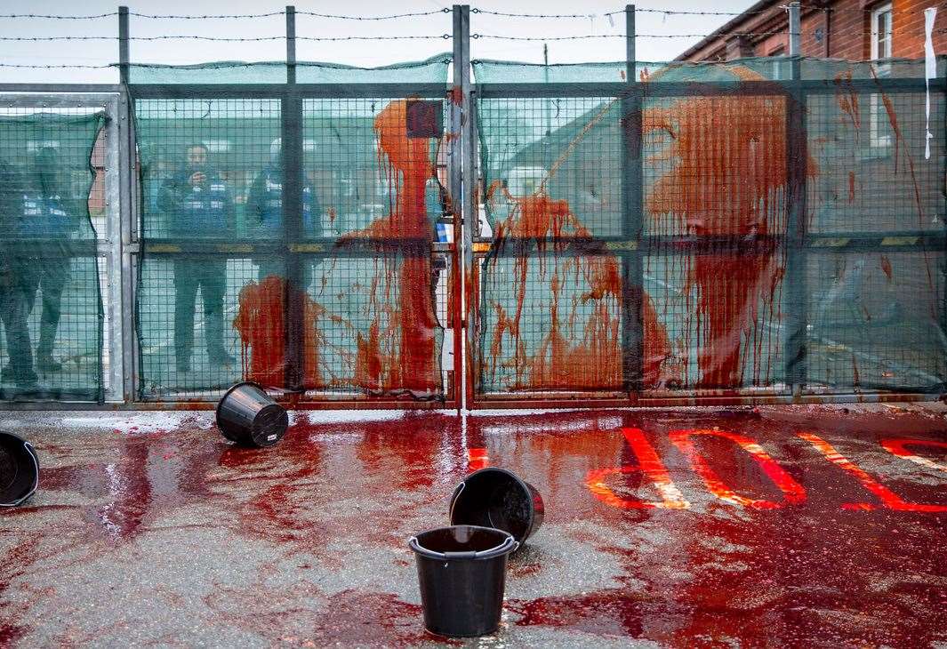 Pictures taken by Mr Aitchison show buckets of fake blood thrown at the gates of Napier Barracks Picture: Andrew Aitchison / In pictures via Getty Images