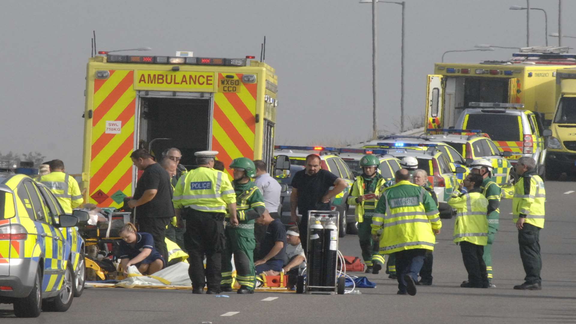 Emergency services treat the injured at the scene of the massive pile-up. Picture: Chris Davey