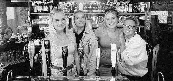 Barmaids Maddie Yates, Lottie Alexander, Charlotte Blaze and Jo Gillard behind the bar at The Bridges pub in Horton Kirby before it closed