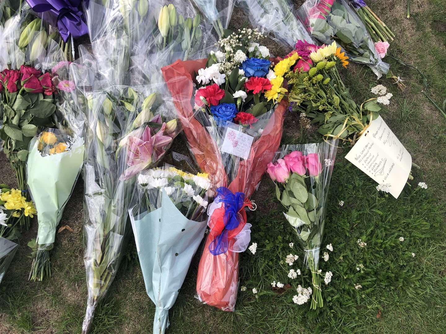 Floral tributes in red, white and blue