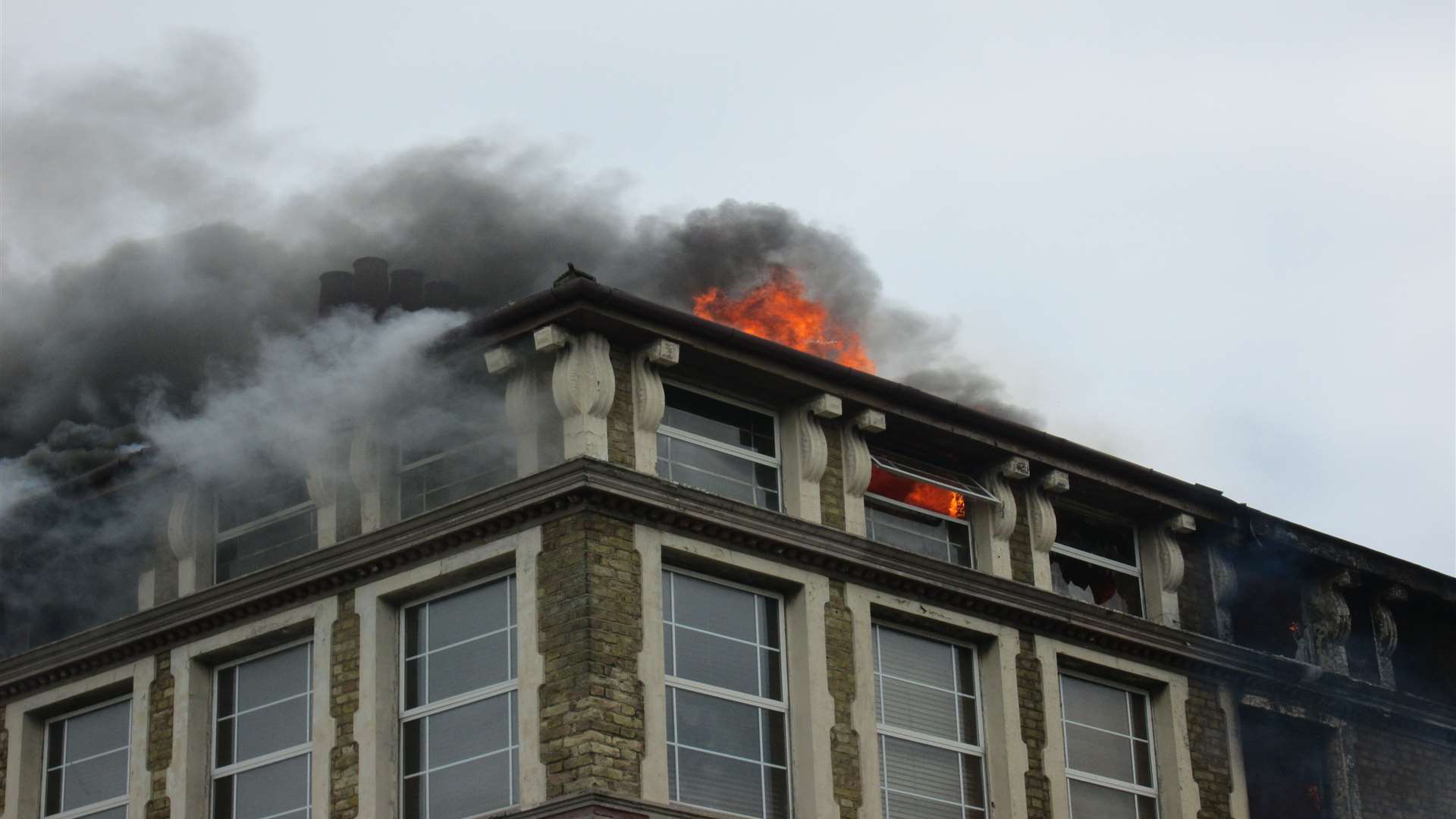 A close-up of the blazing building