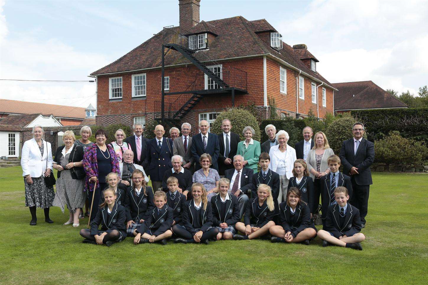 Former and current pupils of Dulwich Preparatory School outside the only original school building