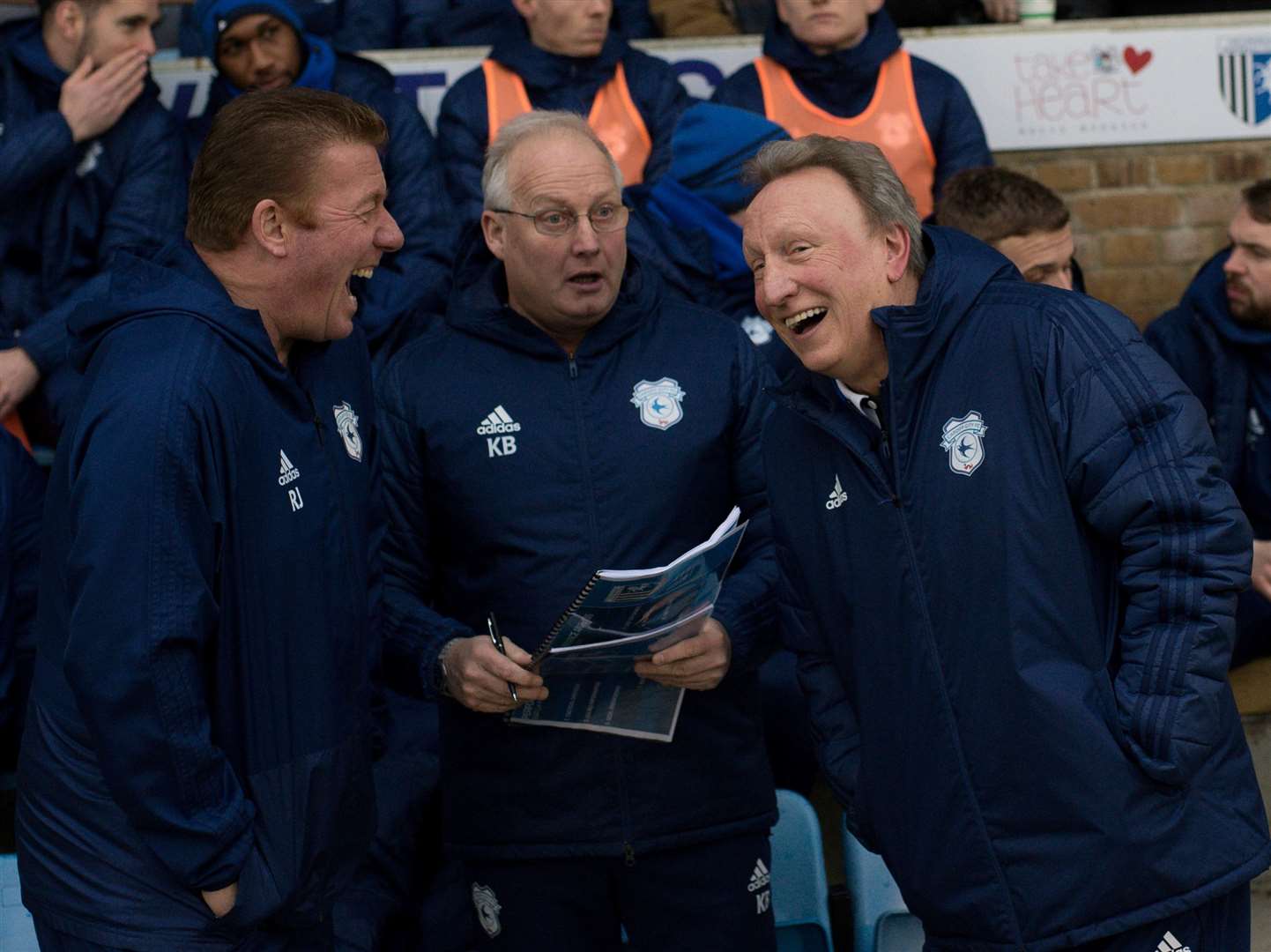 All laughs for the Cardiff bench before their match with Gillingham with former Gills manager Ronnie Jepson (left) and Neil Warnock (right)