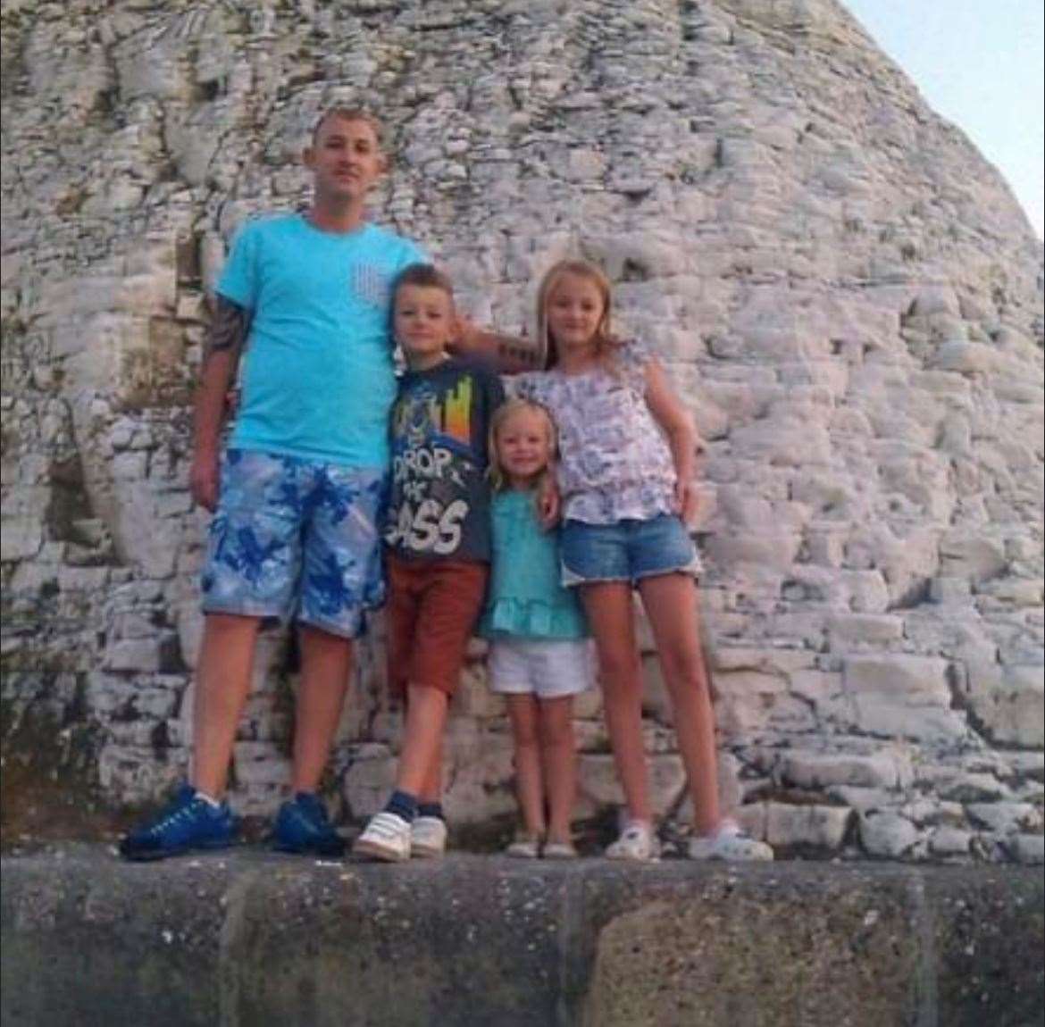 Michael Munday on holiday with his children, Mason, Lydia and Rebecca
