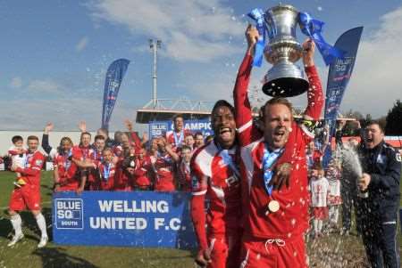Welling captain Lee Clarke lifts the Blue Square Bet South trophy