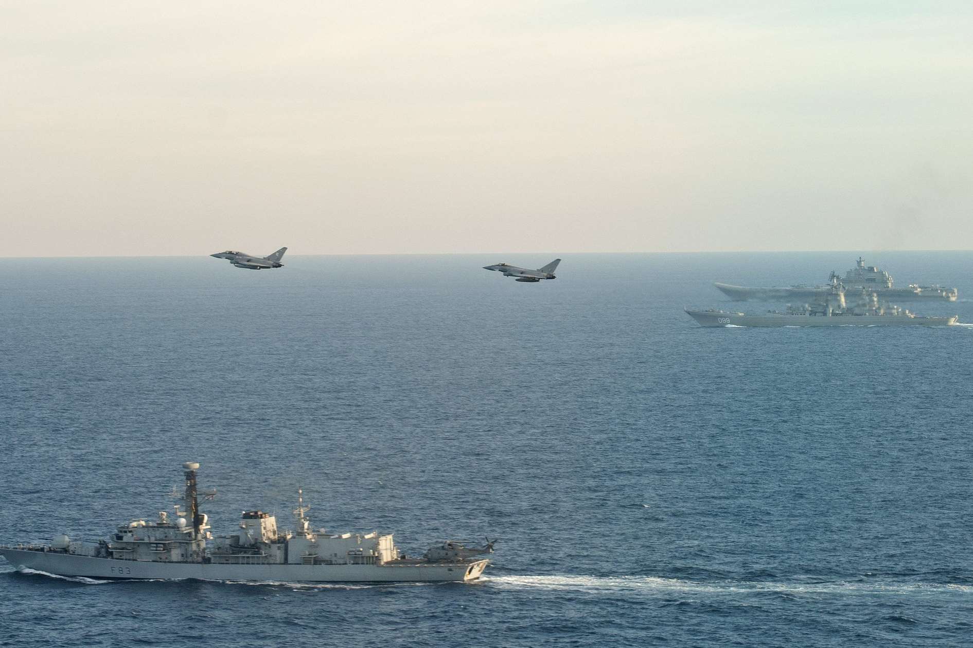 Defence secretary Sir Michael Fallon said HMS St Albans (foreground) was escorting the "skulking" Russian carrier and her task group. Picture: MoD/Royal Navy