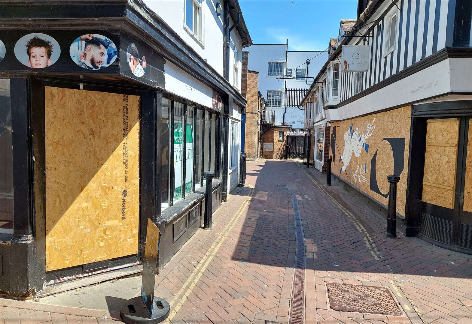 Boarded up shops in the streets surrounding the Tucked Away take away in Ashford