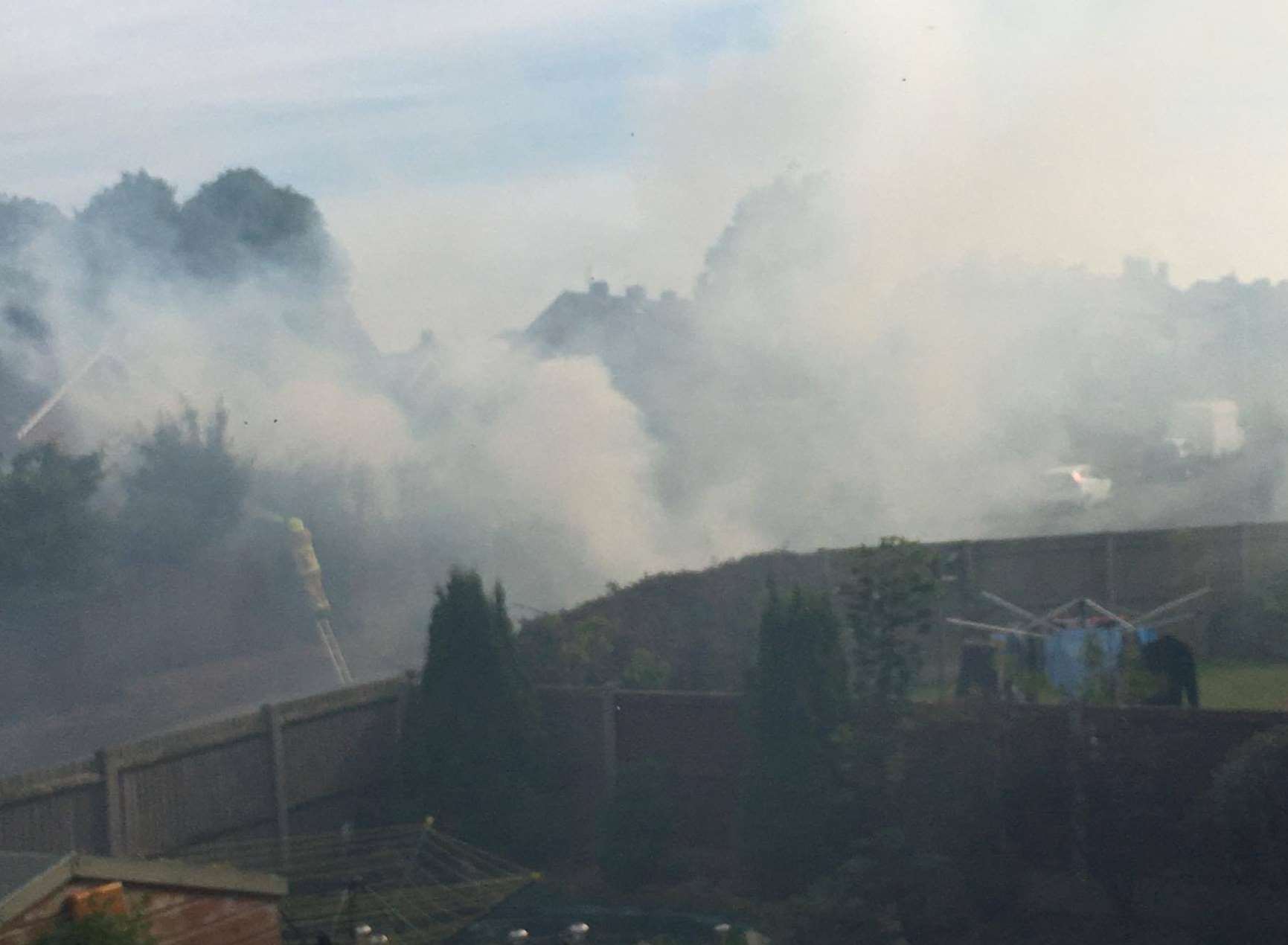 Smoke from the fire filled neighbouring gardens. Photo: Ed Baker