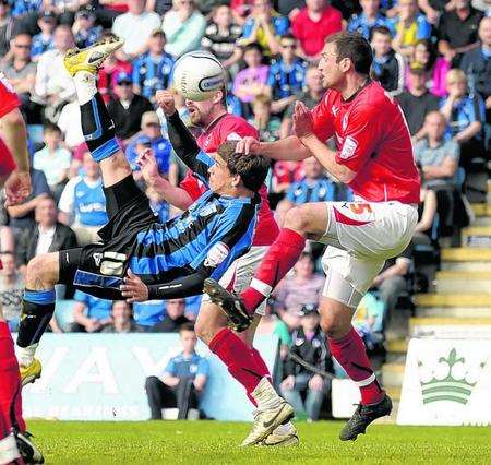 Cody McDonald sends an overhead kick towards goal.