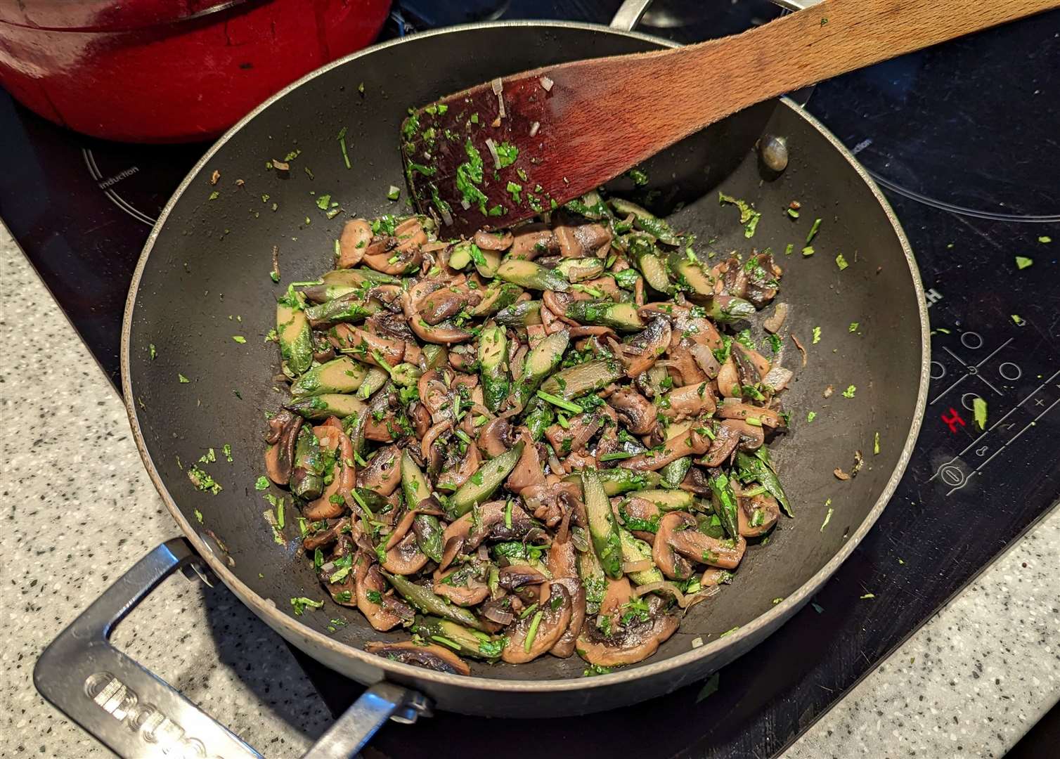 Mushrooms and asparagus from the Folkestone Community Fridge being cooked up for dinner