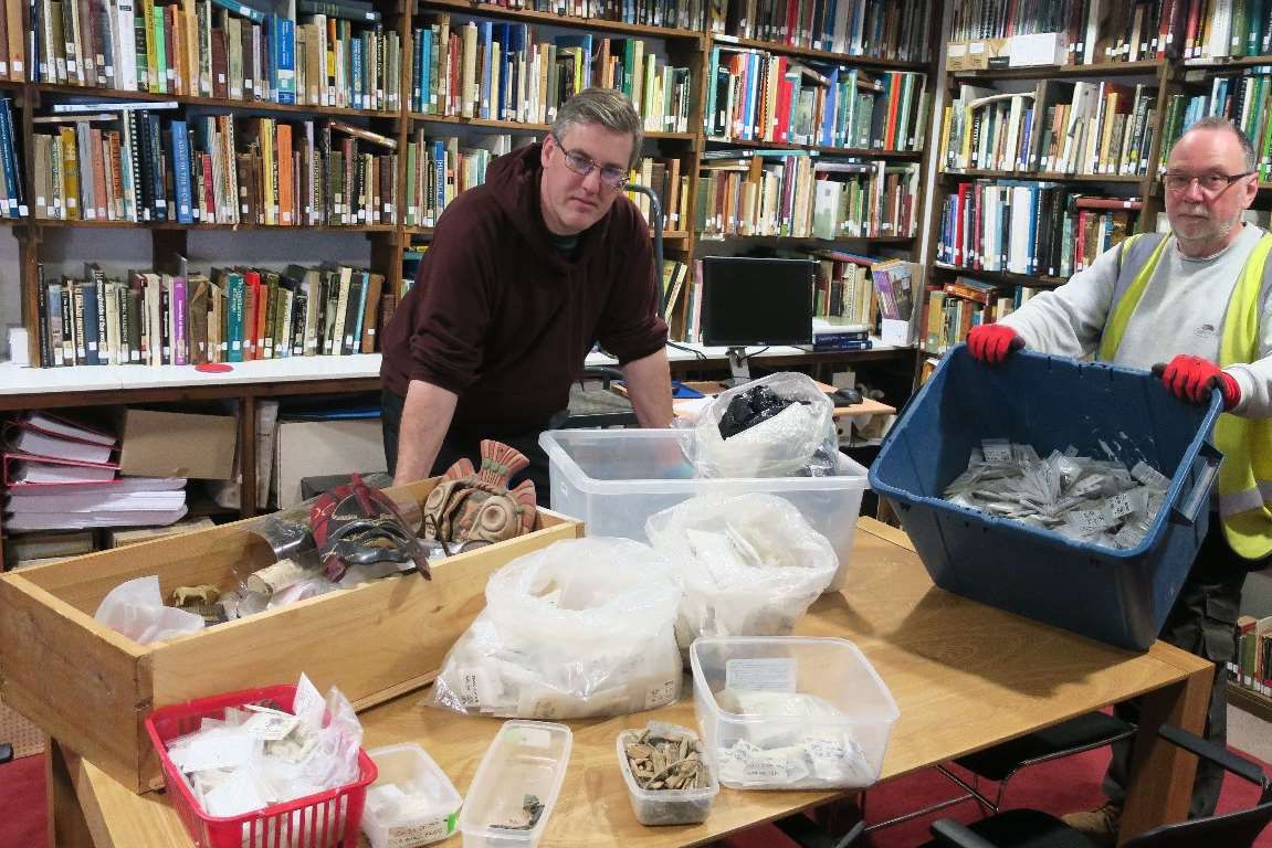 Canterbury Archaeological Trust members log the recovered artefacts