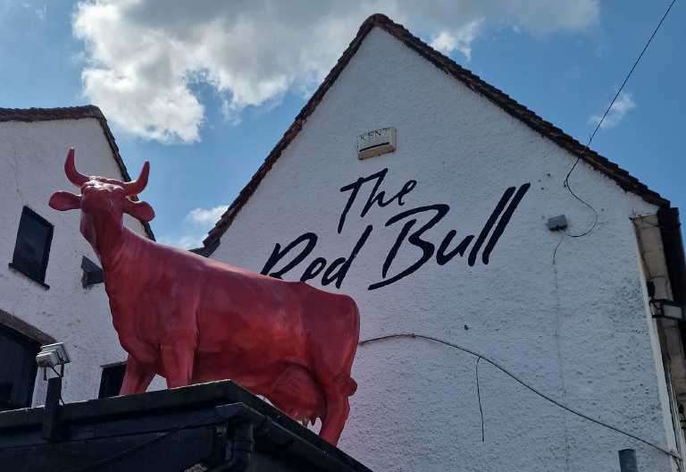 TV famous life-sized ‘bull’ installed on top of The Red Bull pub in Eccles
