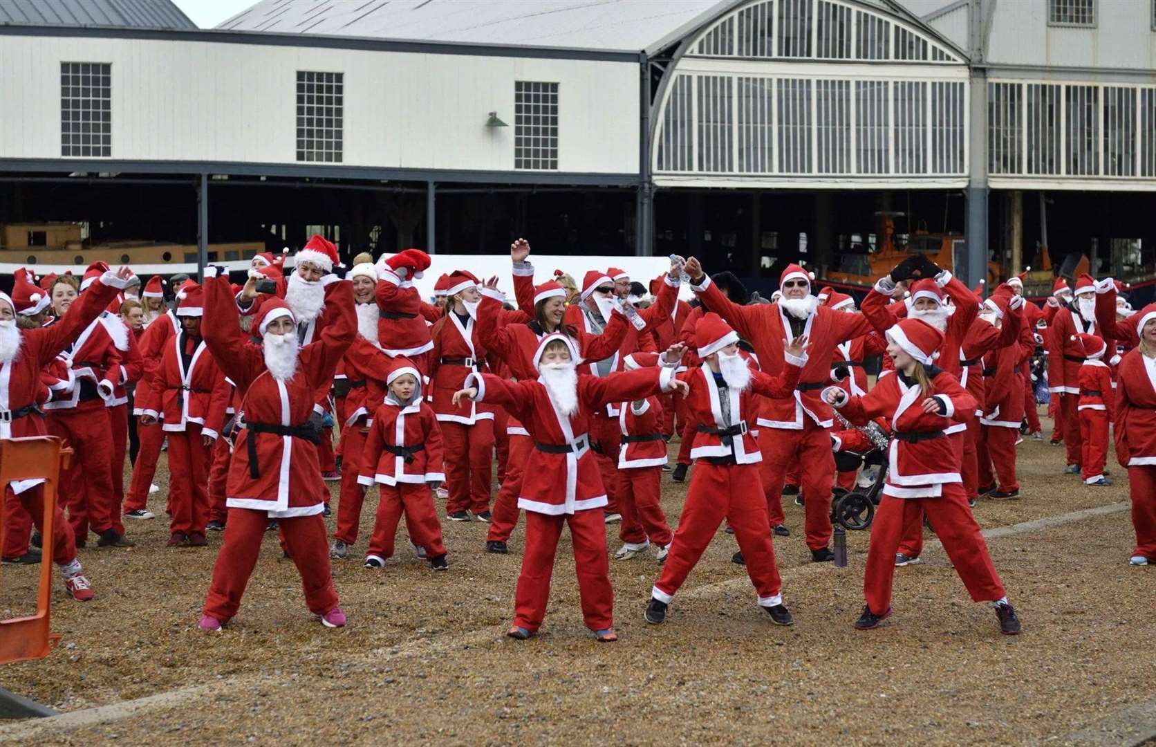 The Fun Run takes Santas through the dockyard, passing ships, buildings and TV sets. Picture: Historic Dockyard Chatham
