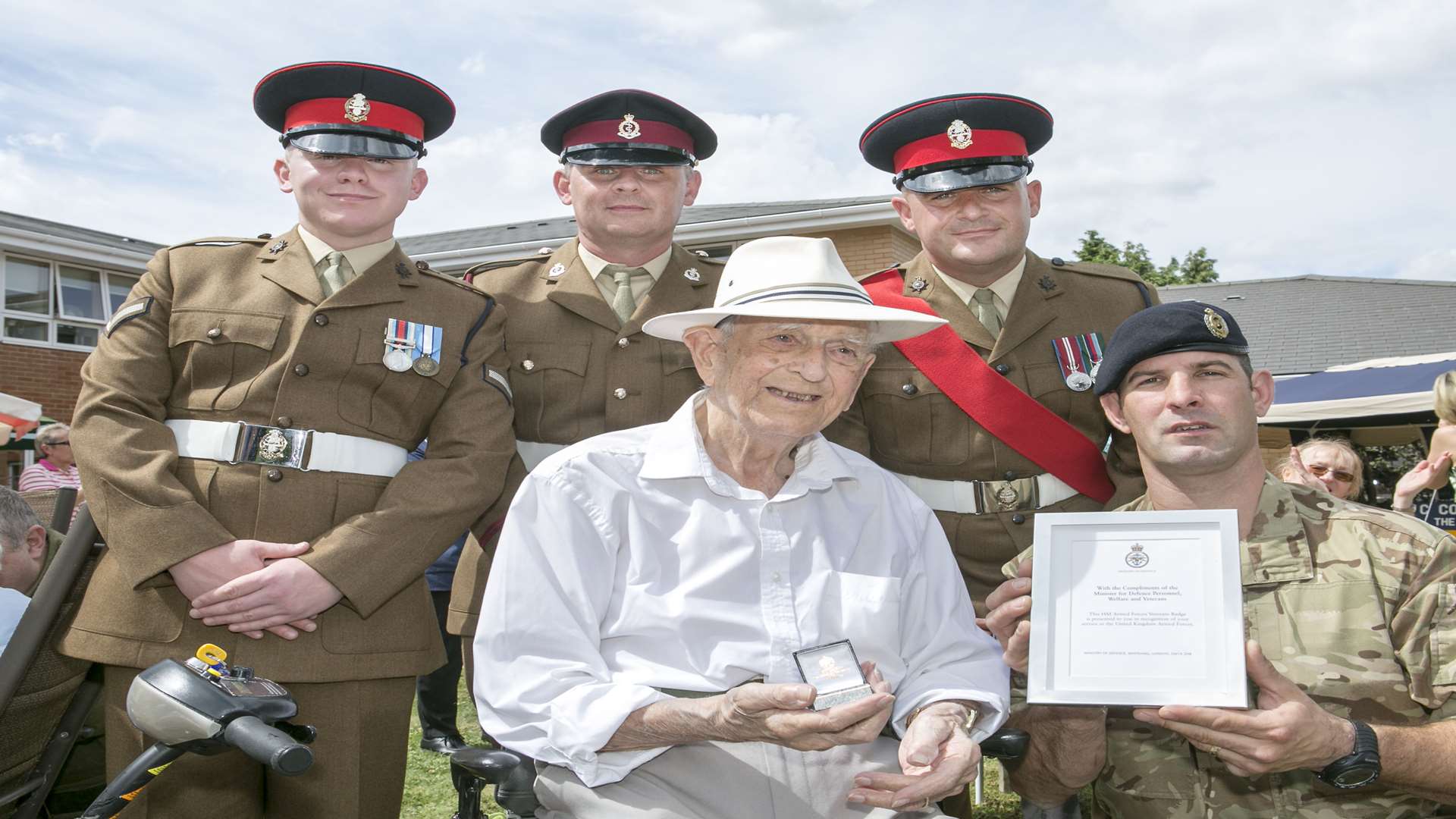 Leonard French gets his award from Cpl Tony Field, Lance Cpl Tony Goode, Lance CPL Martin Purdie, Sgt Rob D Phillips In recognition of his contribution to HM Armed Forces