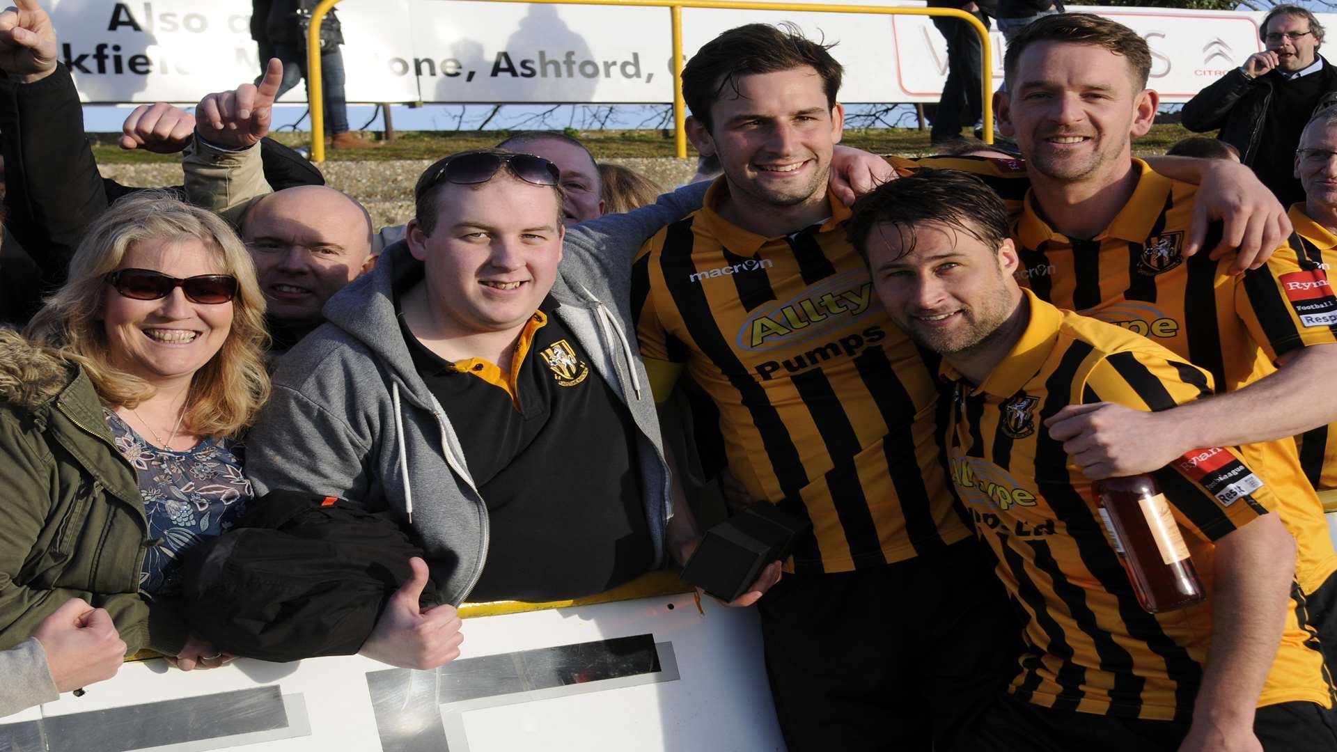 Micheal Everitt celebrates promotion with Liam Friend, Carl Rook and the Folkestone supporters Picture: Gary Browne