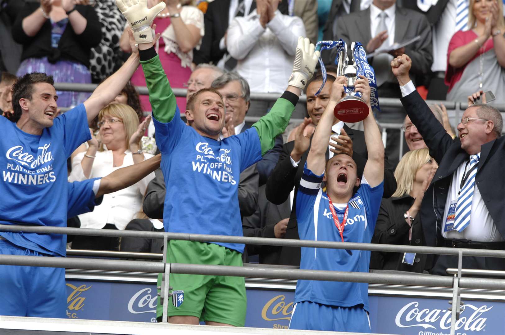 Barry Fuller lifts the League 2 play-off trophy after getting their revenge on Shrewsbury at Wembley Picture: Matthew Walker