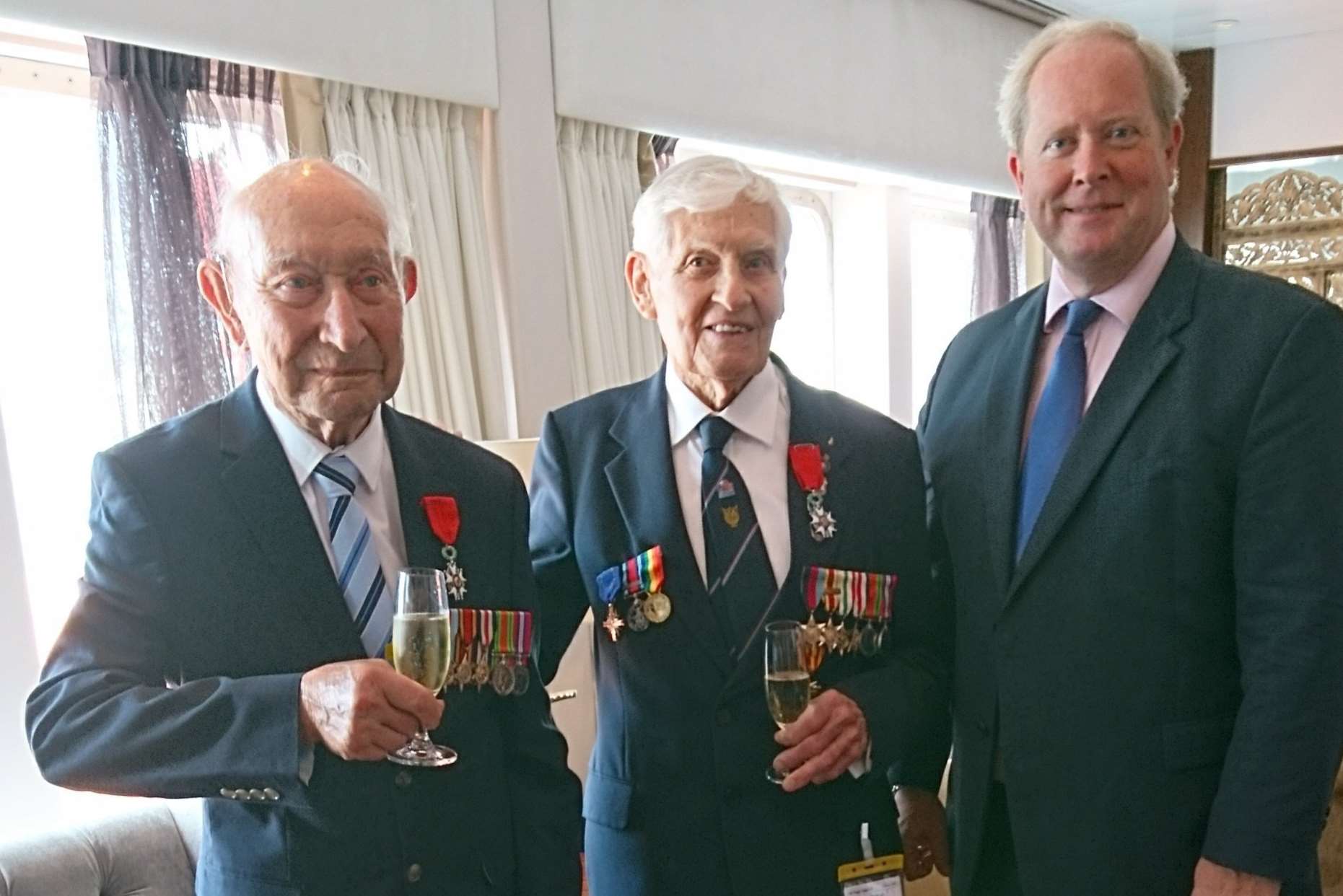 Presentation of Legion d'Honneur medals to Normandy veterans aboard Saga Sapphire cruise ship at Dover. Stanley Robert Elliss, left, and Richard Samson get medals from James Ryeland, managing director of George Hammond