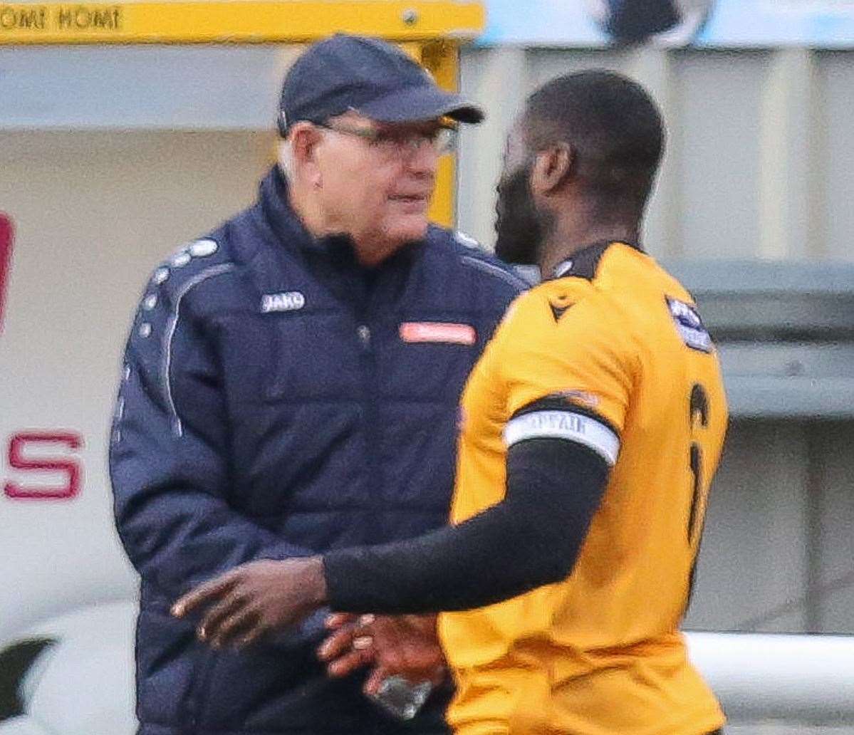 John Still talks tactics with captain George Elokobi Picture: Matthew Walker