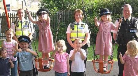 PC Jason Lynch with PCSOs Sam Dixon and Christine Cleland and some of the local children