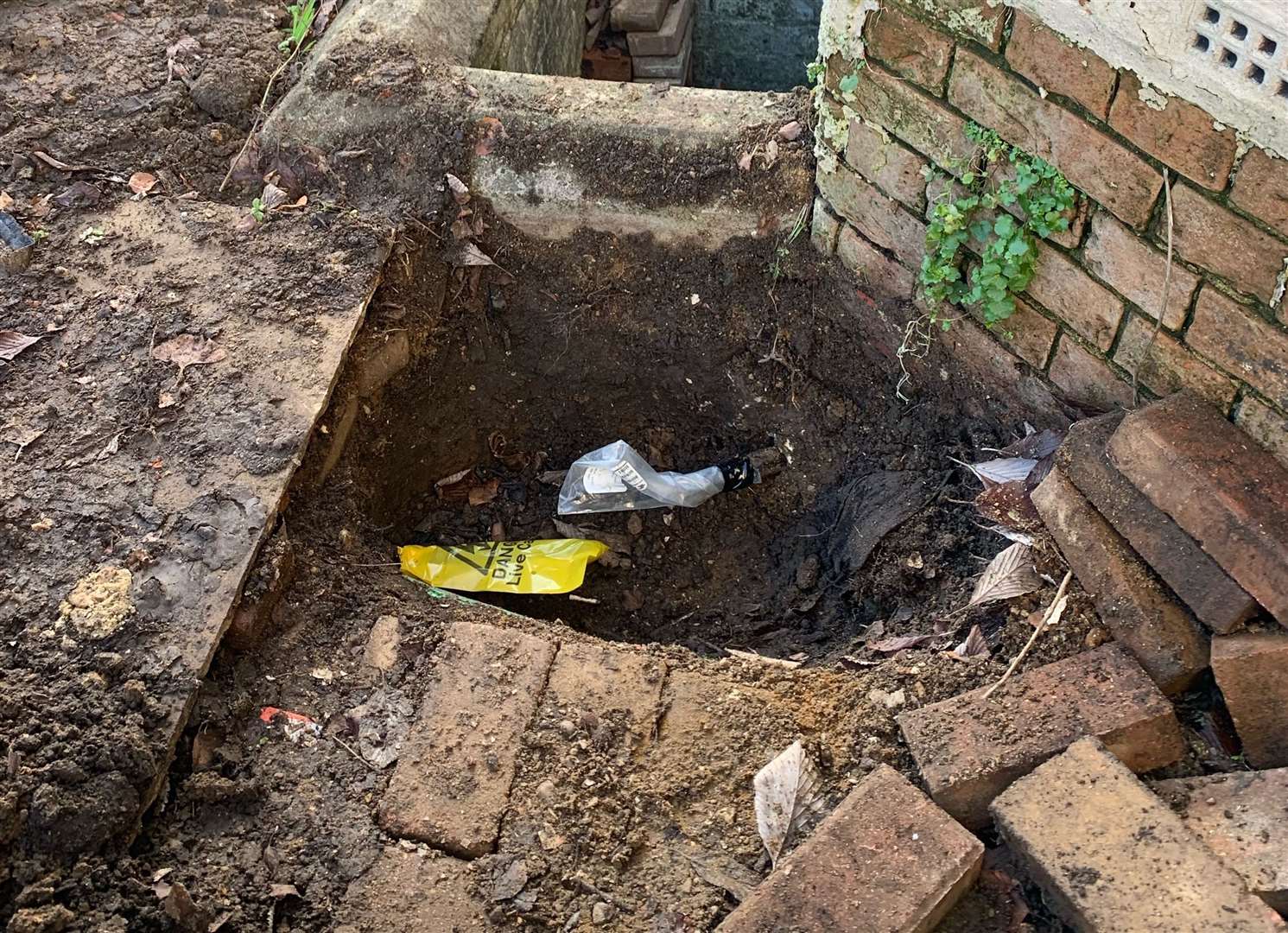 A wire in a hole in front of the house in Maidstone. Picture: Graham Jarvis