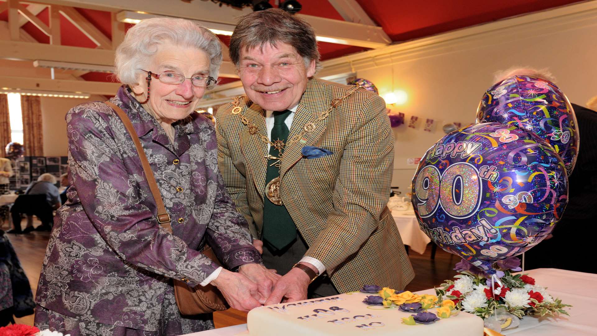 Doris Rutherford, 98, and Gravesham Mayor Michael Wenban, cut the cake for the Queen's 90th