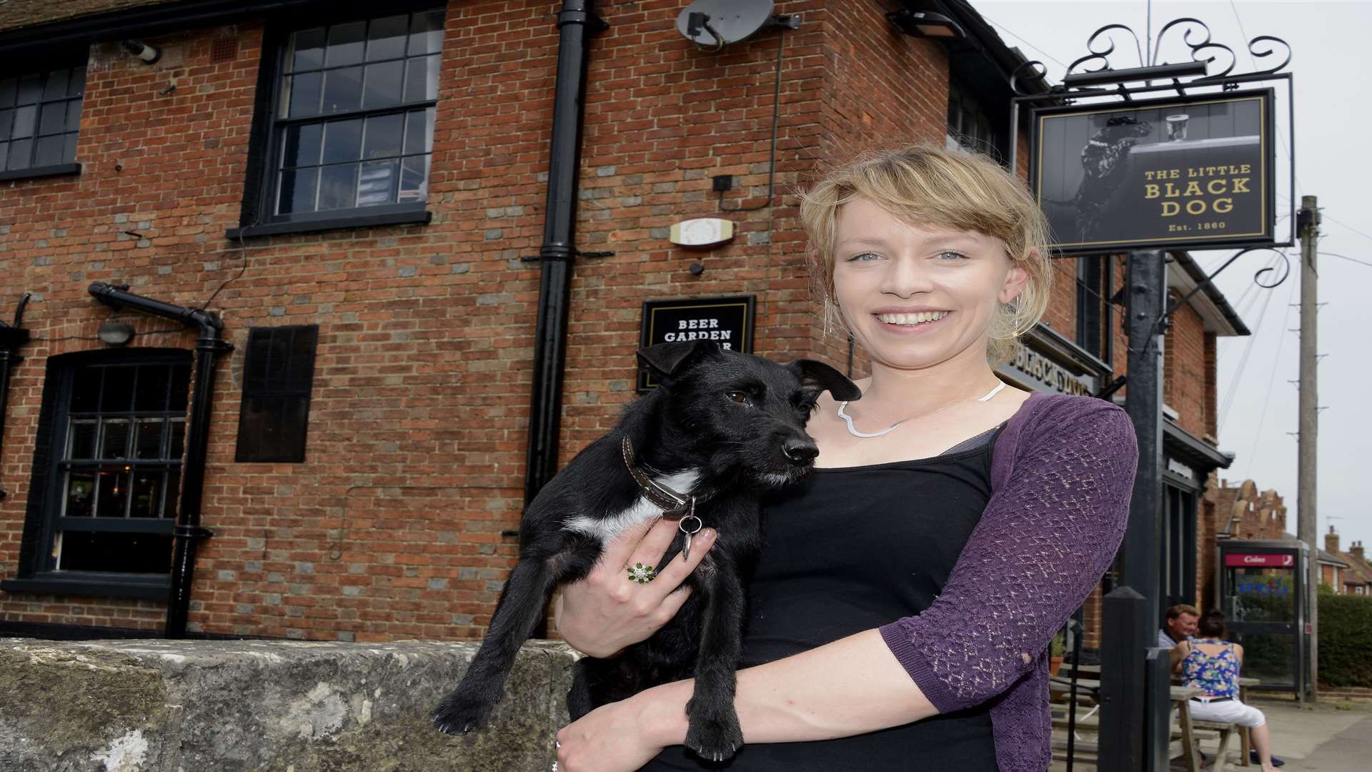 Great Chart landlady Helene Smith with Peg, her own Little Black Dog, outside the renamed pub.
