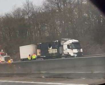 The burnt-out lorry which caused delays this morning