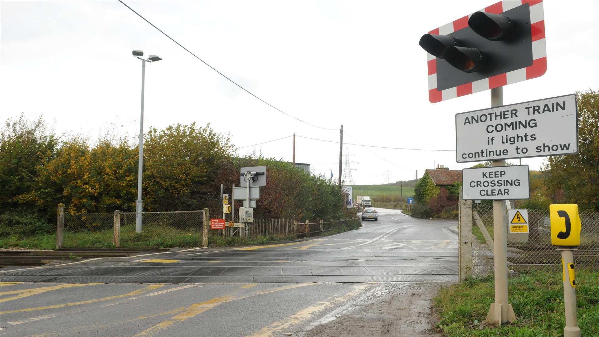 The level crossing barrier is shut at Broad Oak.
