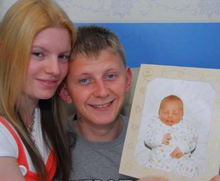 The pain is always there - Lucy and Robert with a picture of their cherished baby, Curtis