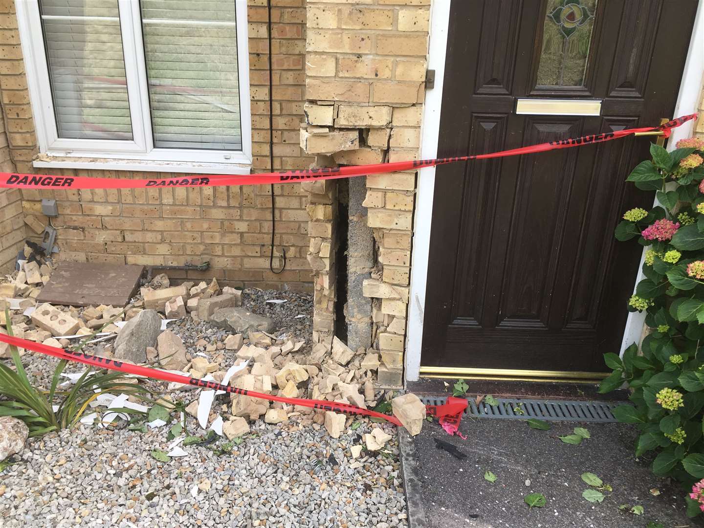 Damage to the wall of one house after a Vauxhall Astra car crashed into it in Quinton Road at the junction of Sonora Way, Sittingbourne (12397882)